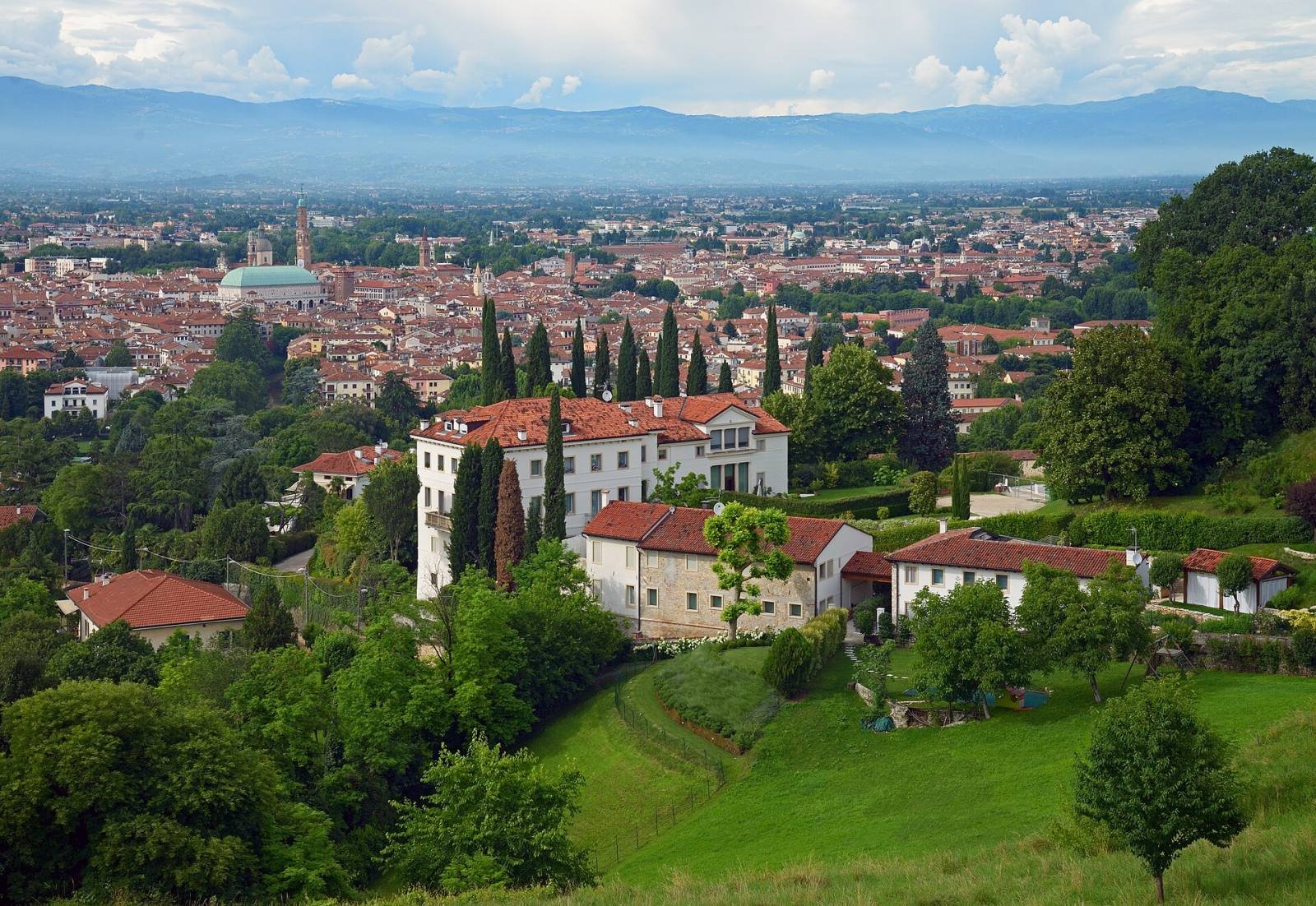 Vicenza seen from Monte Berico, with villas and gardens in the foreground and mountains beyond