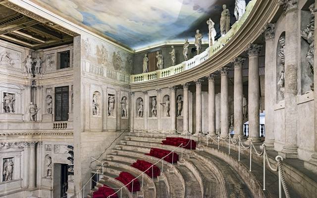 The curved wooden tiers of seats inside the Teatro Olimpico in Vicenza