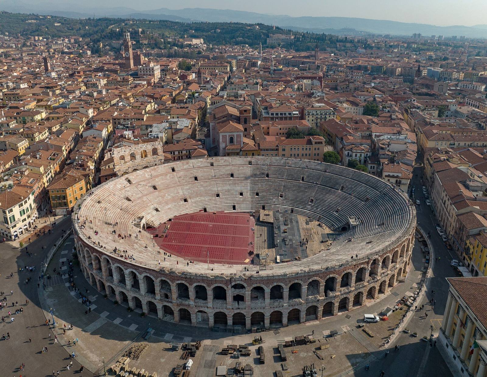 The Roman Arena of Verona seen from above, surrounded by the city’s rooftops