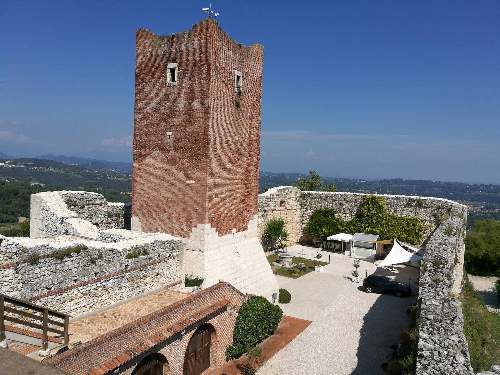 The brick tower and courtyard inside the walls of Romeo’s Castle