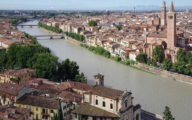The rooftops and church towers of Verona along the Adige river